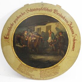 Schießscheibe mit Haberfeldtreiben als Bildmotiv, bemalt durch den Miesbacher Maler und Zeichenlehrer Alois Dirnberger (1823-1897), 1883 von Maurermeister Johann Schönauer der Schützengesellschaft Miesbach gestiftet. (Königlich priviligierte Feuerschützengesellschaft Miesbach)