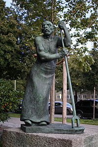 Die Figur "Blockwalzer" wurde 1929 von Fritz Koelle (1895-1953) als Denkmal für die Arbeiter geschaffen und 1930 am Münchner Karl-Preis-Platz aufgestellt. Von den Nazis wurde sie 1933 wieder entfernt. 1976 konnte sie wieder aufgestellt werden. (Gemeinfrei via Wikimedia Commons)